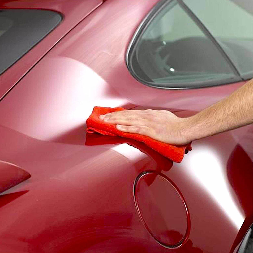 buffing Autoglym Extra Gloss Protection on to car