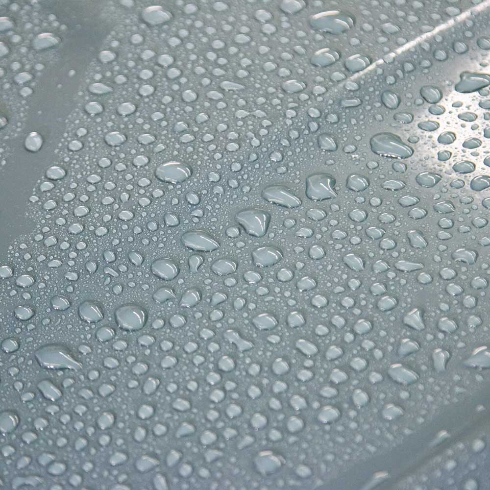 close up water beading on car body