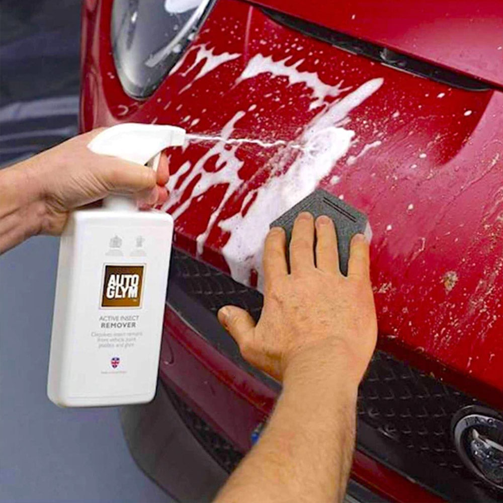 spraying Autoglym Active Insect Remover on car exterior