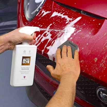 spraying Autoglym Active Insect Remover on car exterior