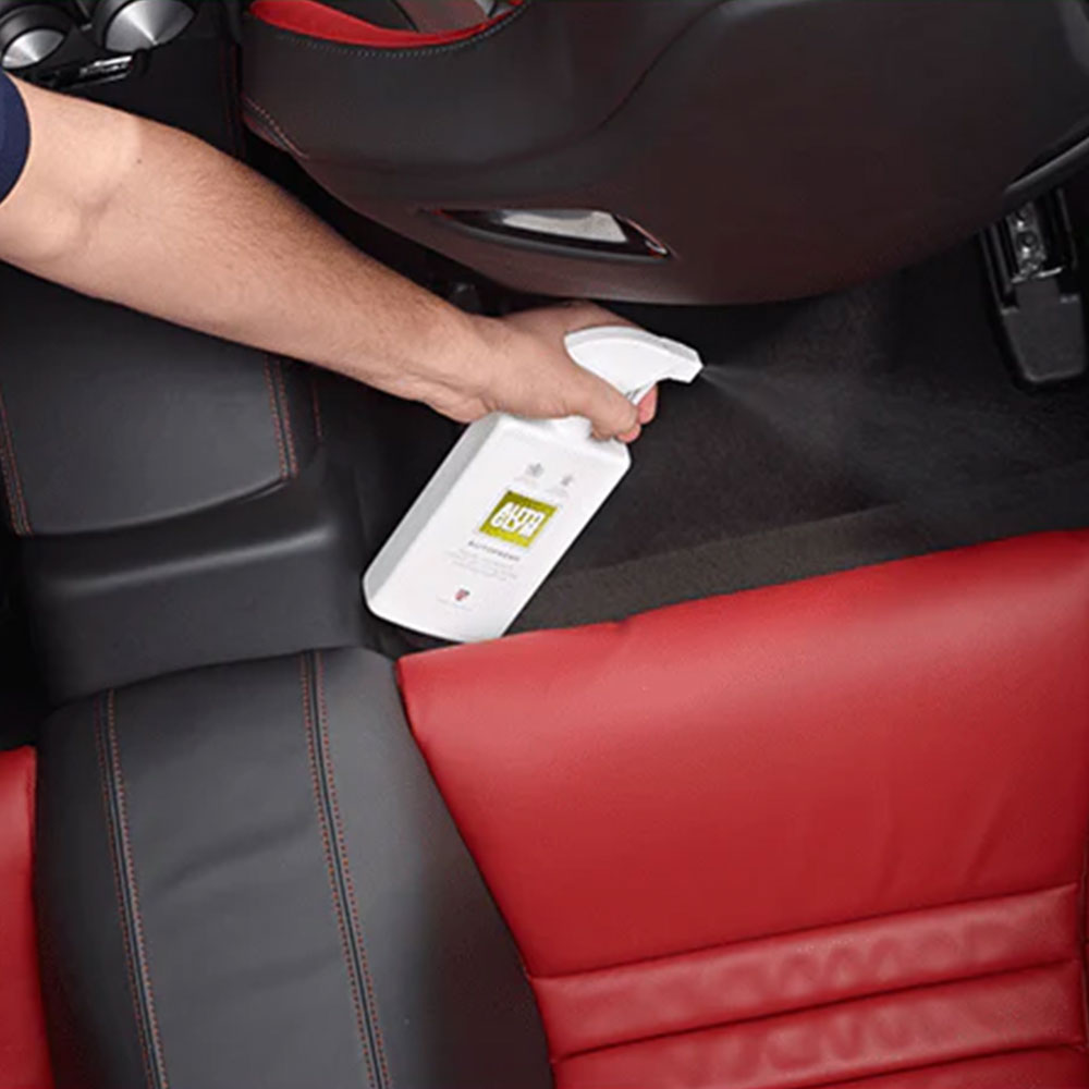 spraying Autoglym Autofresh into car interior