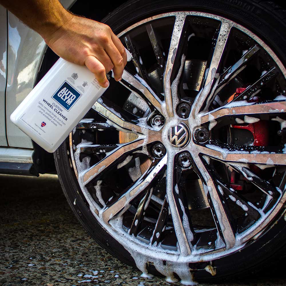 spraying Autoglym Custom Wheel Cleaner on to car wheel