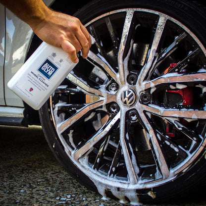 spraying Autoglym Custom Wheel Cleaner on to car wheel