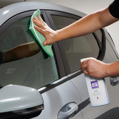 wiping car window with Autoglym Fast Glass and microfibre cloth