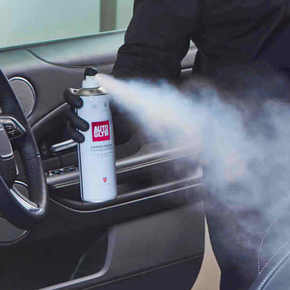 spraying Autoglym Hyperfresh Crushed Berries deoderant in car