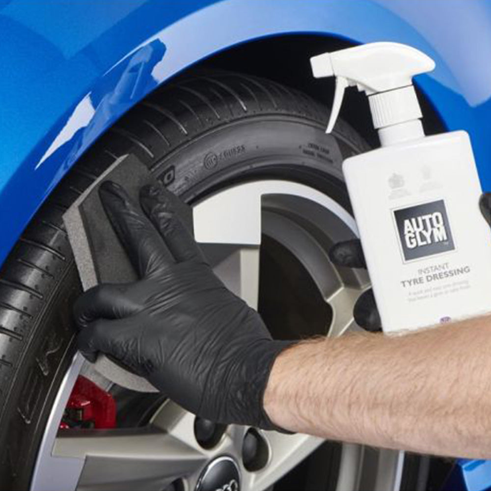applying Autoglym Instant Tyre Dressing with sponge