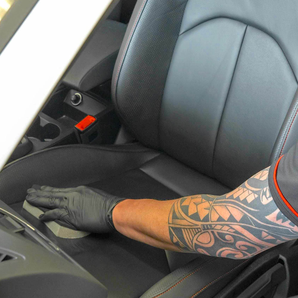applying Autoglym Leather Care Balm to car seat