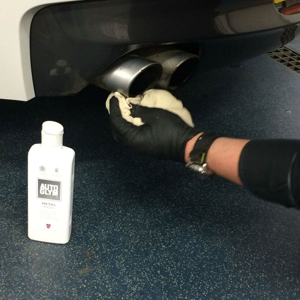 using Autoglym Metal Polish to clean exhaust pipe