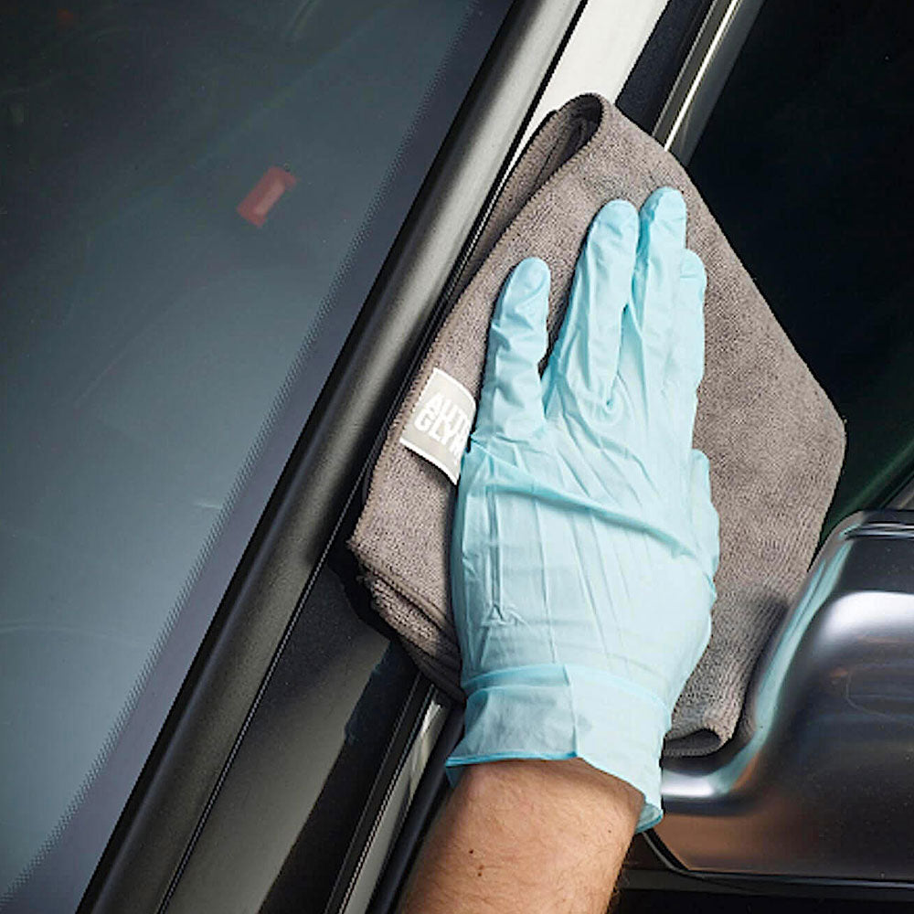 hand polishing car plastic with soft cloth and Autoglym Plastic And Trim Conditioner