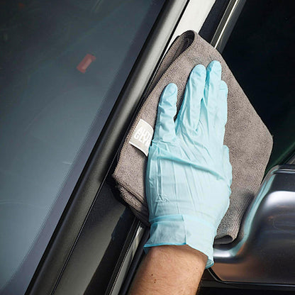 hand polishing car plastic with soft cloth and Autoglym Plastic And Trim Conditioner