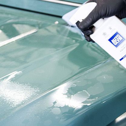 spraying Autoglym Rapid Aqua Wax onto car body