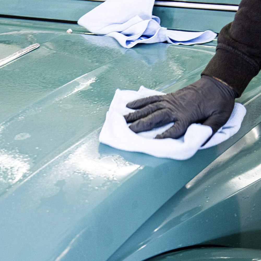 polishing Autoglym Rapid Aqua Wax with microfibre cloth