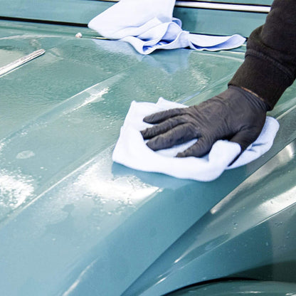 polishing Autoglym Rapid Aqua Wax with microfibre cloth