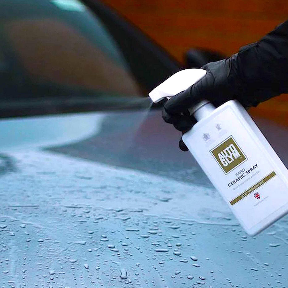 spraying Autoglym Rapid Ceramic Spray onto wet vehicle