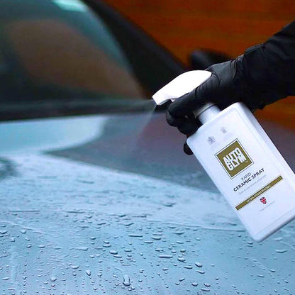 spraying Autoglym Rapid Ceramic Spray onto wet vehicle