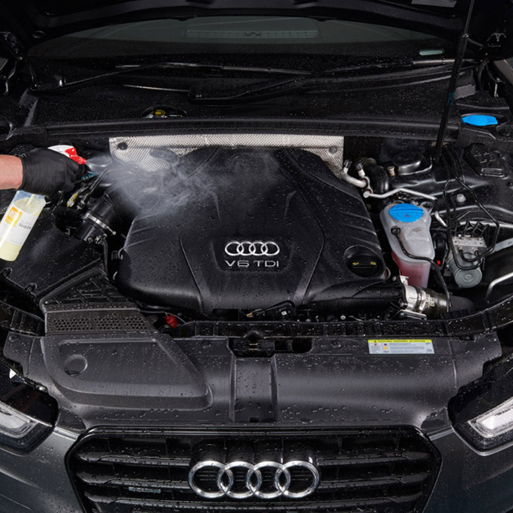spraying autoglym super sheen on car engine