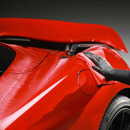 polishing Autoglym Ultra High Definition Wax on red car body
