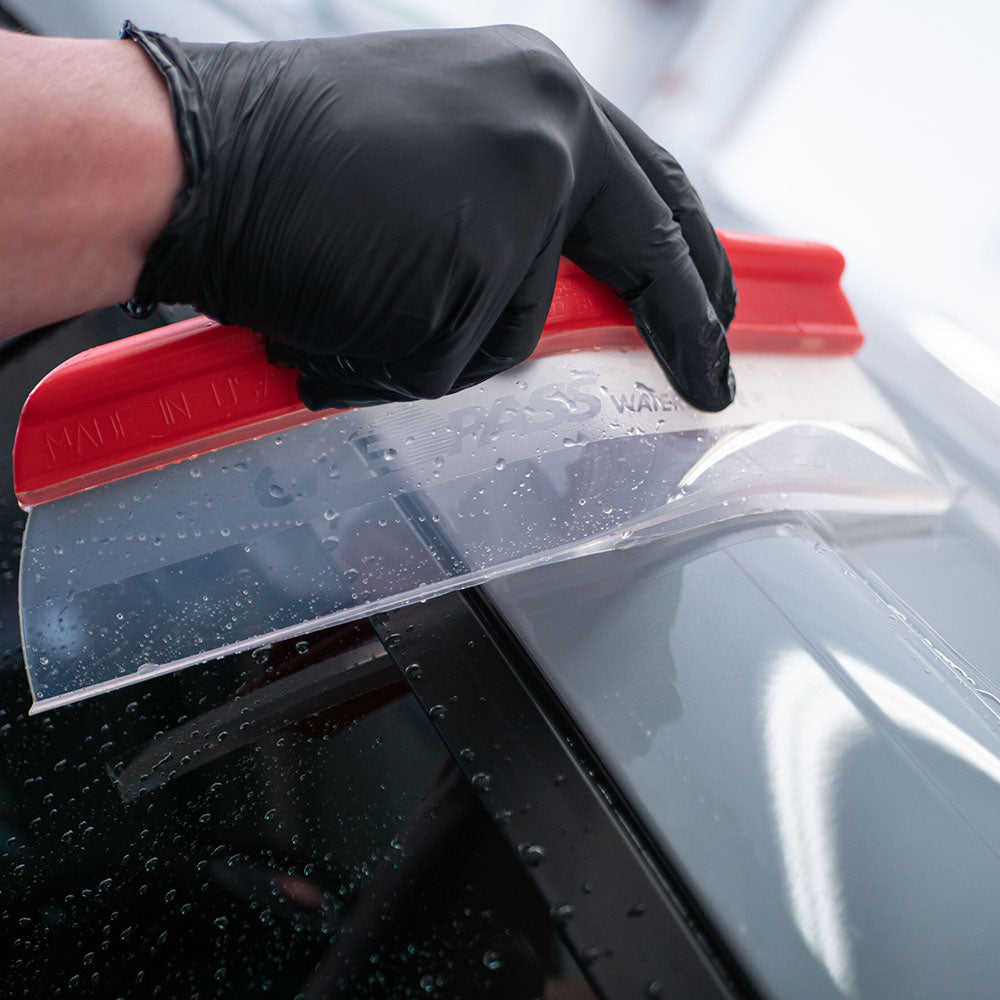 close up of Autoglym Water Blade scraping water off car