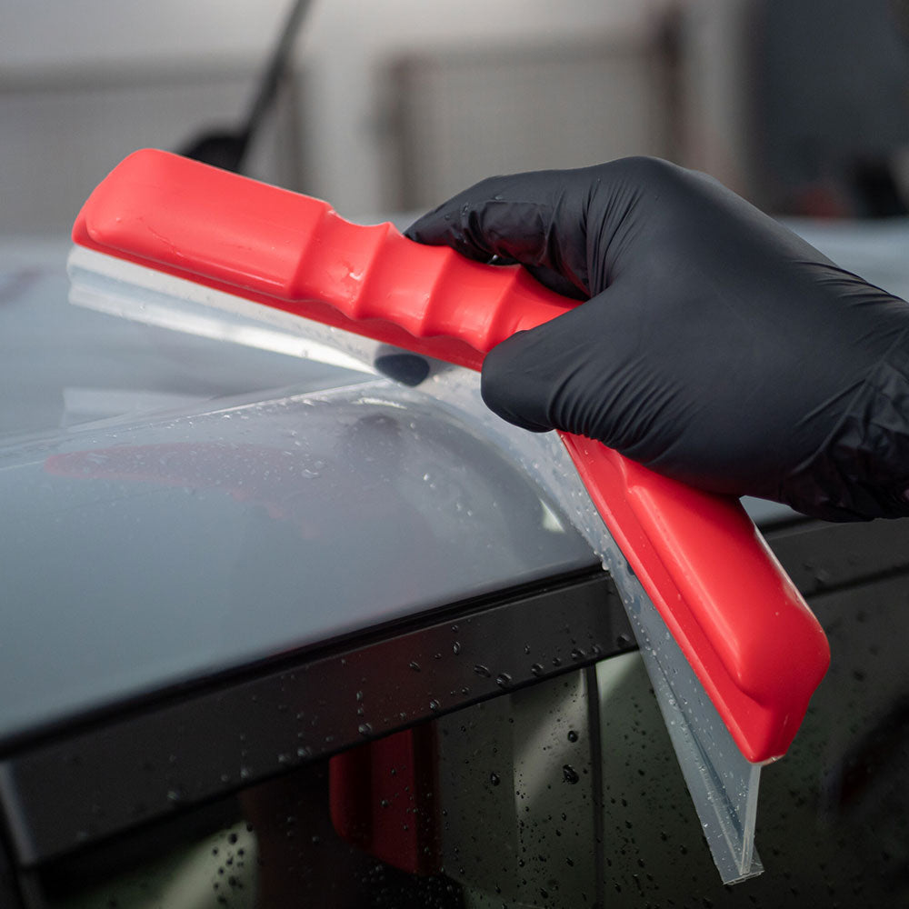 close up of Autoglym Water Blade flexing around car body