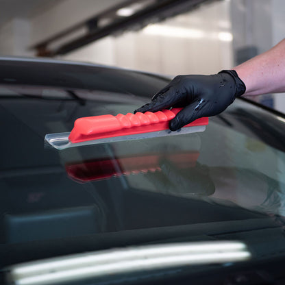 close up of Autoglym Water Blade scraping water off car