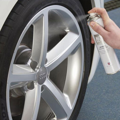 spraying Autoglym Wheel Protector onto car wheel