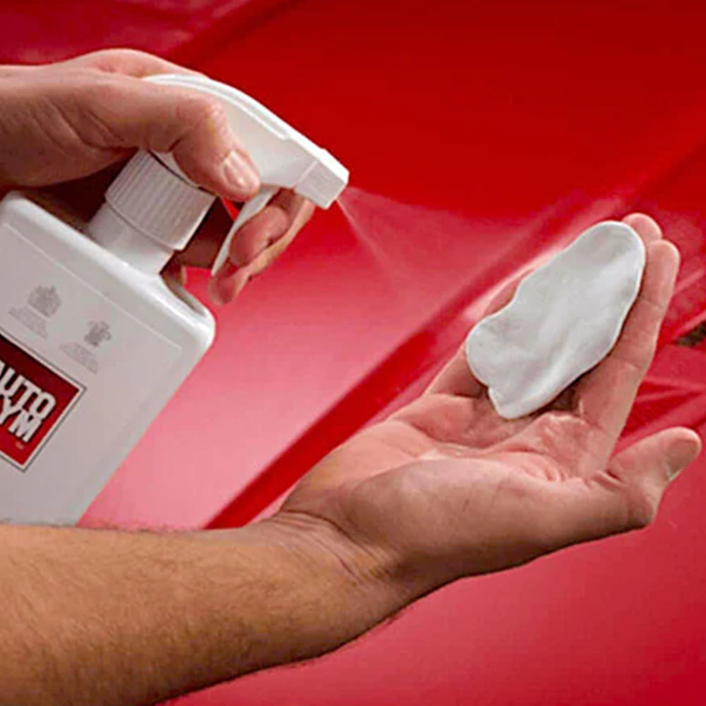 spraying autoglym rapid detailer onto cotton cloth