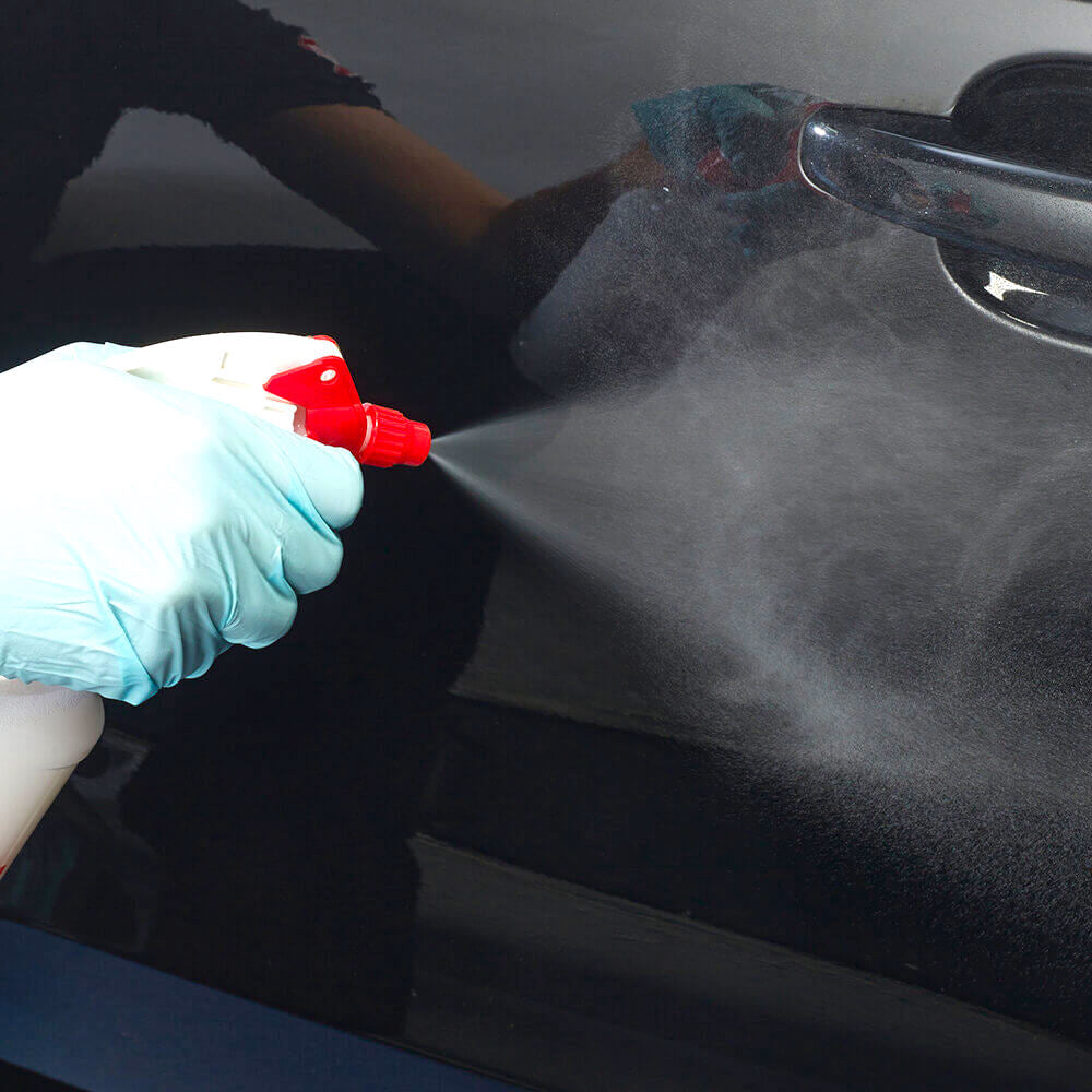 spraying Autoglym Fast Shine and Lube on car door