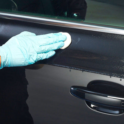wiping Autoglym Fast Shine and Lube on car