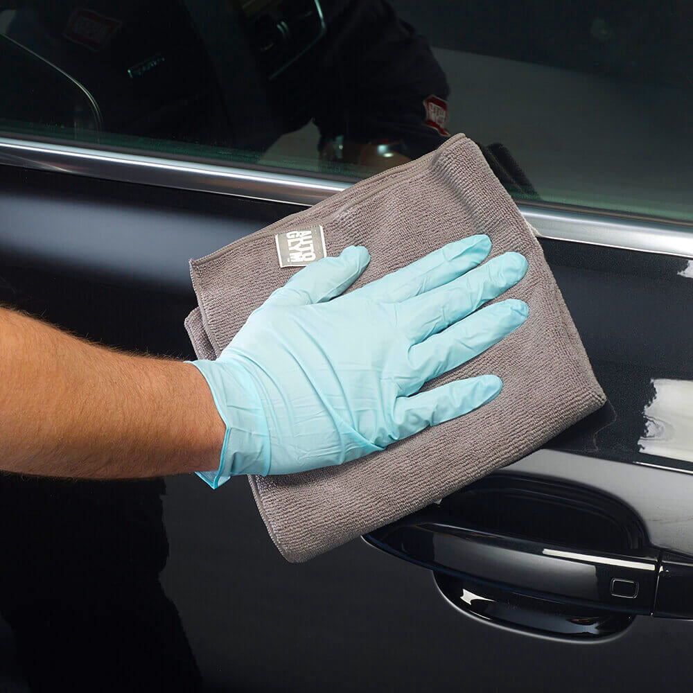 polishing Autoglym Fast Shine and Lube on car exterior