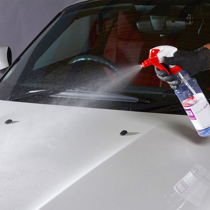 spraying autoglym liquid clay onto car bonnet