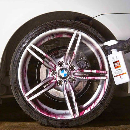 spraying autogly magma onto car wheel