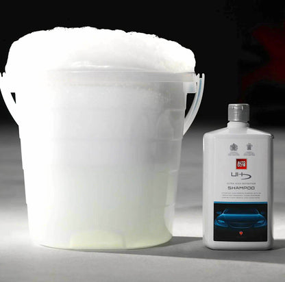 bucket full of water mixed with Autoglym Ultra High Definition Shampoo