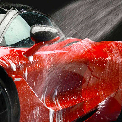 rinsing Autoglym Ultra High Definition Shampoo off car with hose