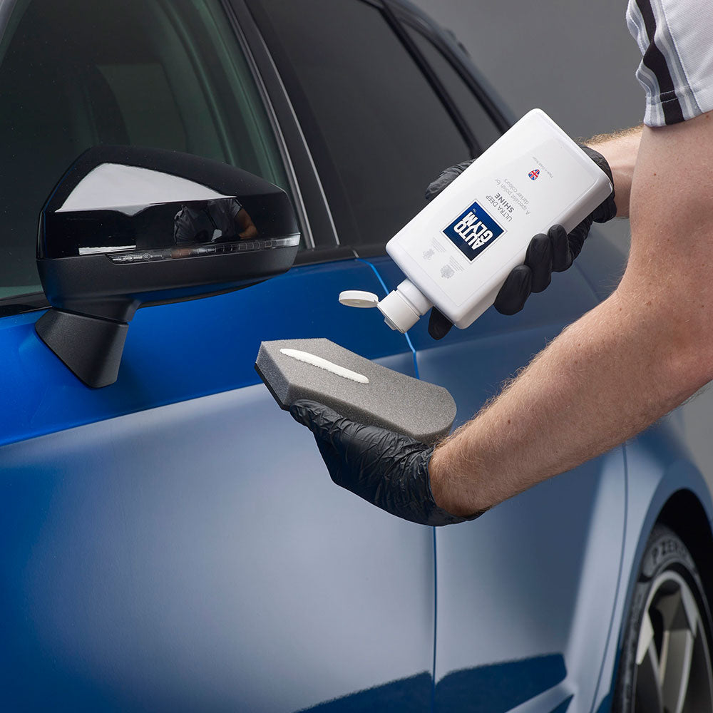 applying autoglym ultra deep shine to applicator sponge with gloves
