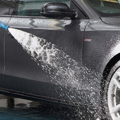 rinsing clean car wheels with hose