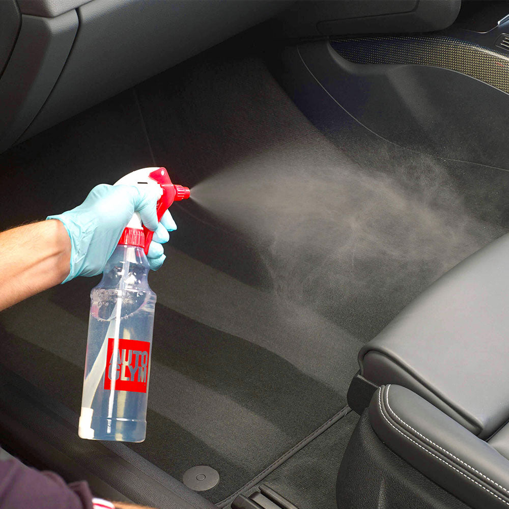 spraying autoglym autofresh into car interior