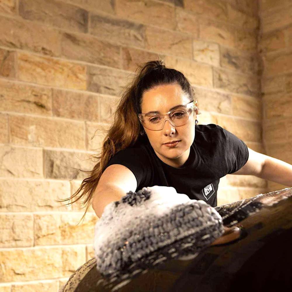 woman cleaning car