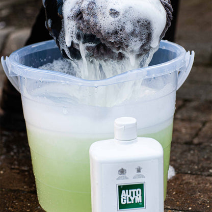 close up squeezing foaming sponge 
