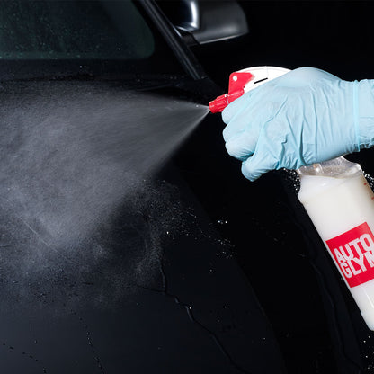 spraying autoglym express wax on to car bonnet