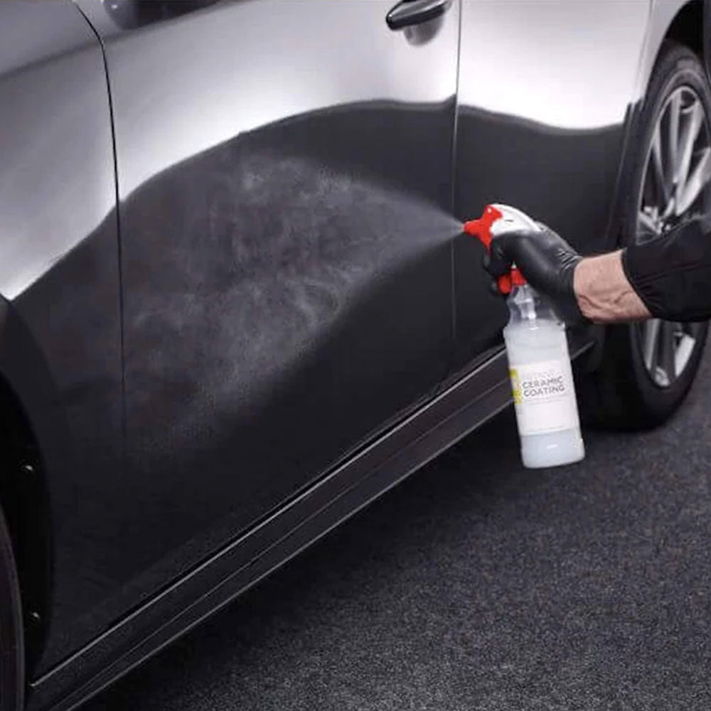 spraying autoglym instant ceramic coating on car exterior